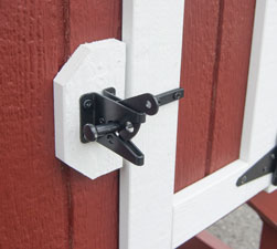 easy open latches on doors of rabbit hutch animal shelter constructed by Pine Creek Structures