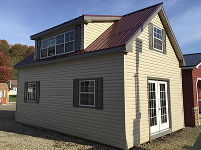 16x24 two-story cape cod building with vinyl siding, patio doors, a second floor, and unfinished interior in connellsville, pa