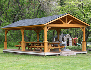 wood peak pavilion with floor and savannah posts from Pine Creek Structures